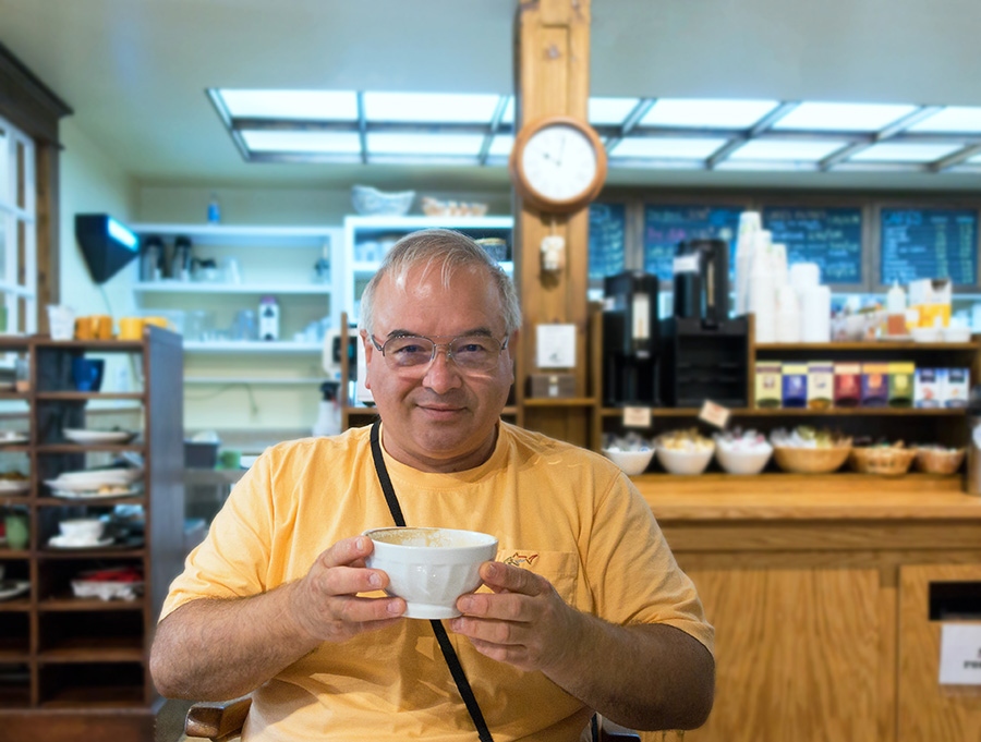 Dennis drinking coffee in Caraquet