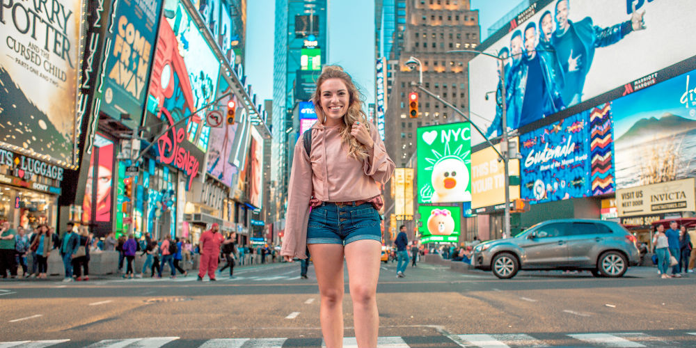 travel blogger in New York City Times Square