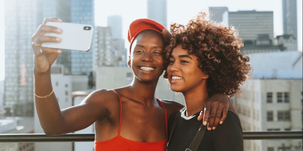 travel influencers taking selfie